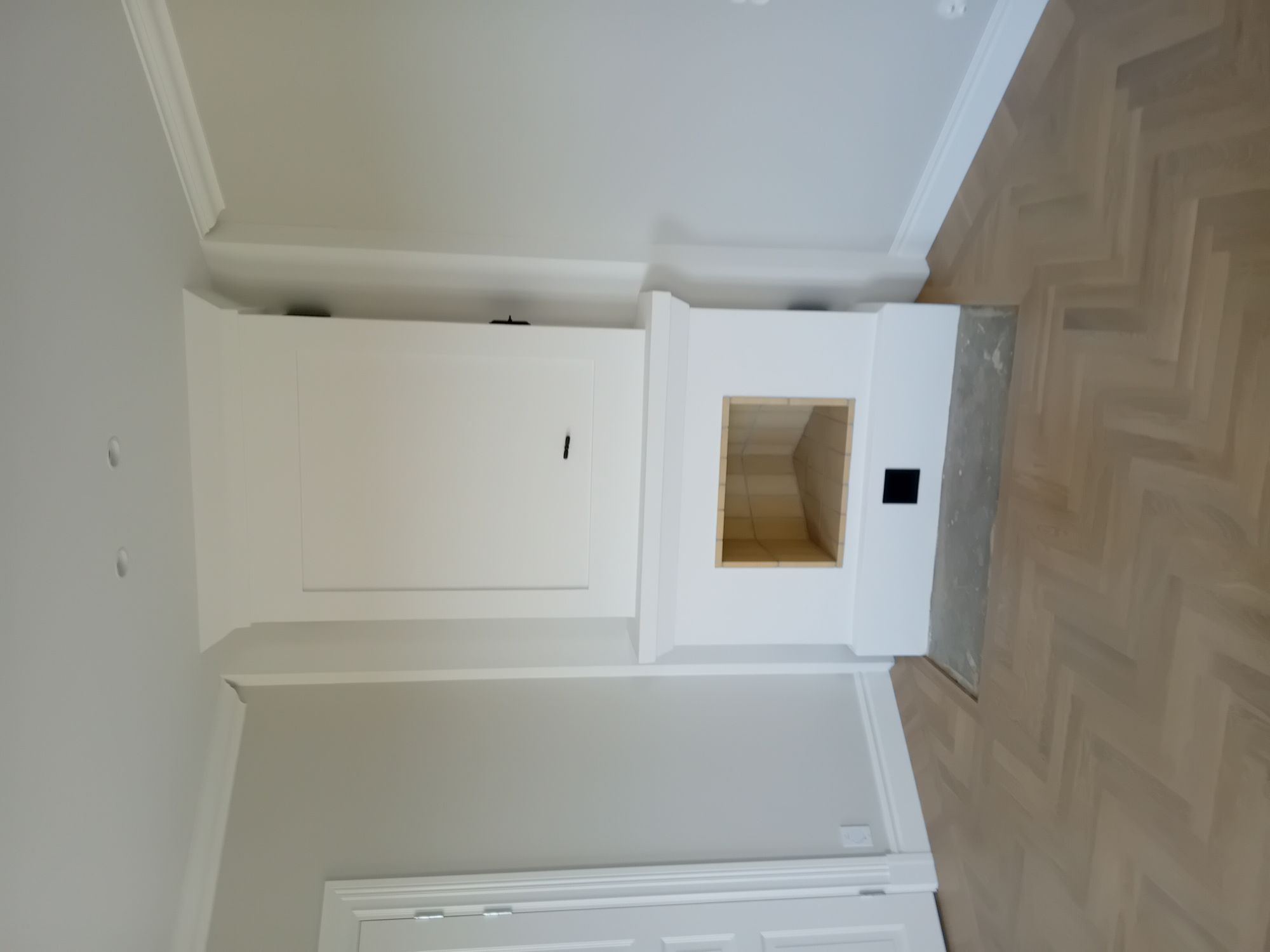 Nyrenoverad eldstad i hörn – kakelugnsrenovering i Linköping